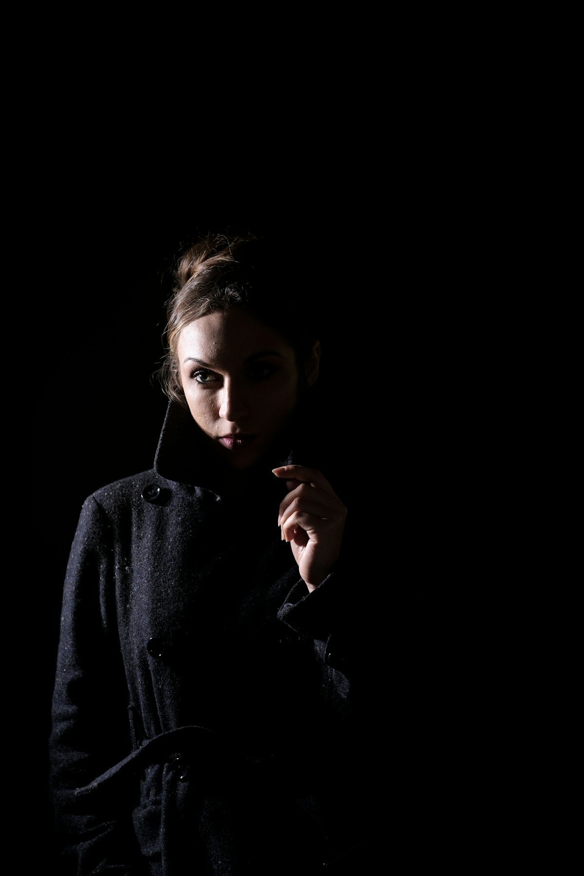 Cinematic fashion portrait in dramatic light